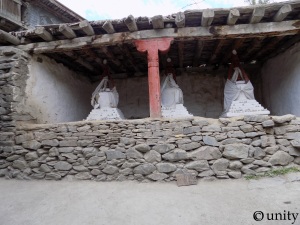 Three little stupas in the middle of the village